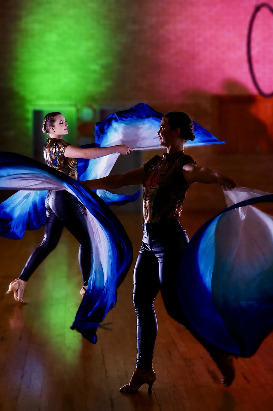 Fan and veil dance performance with flowing silk fans